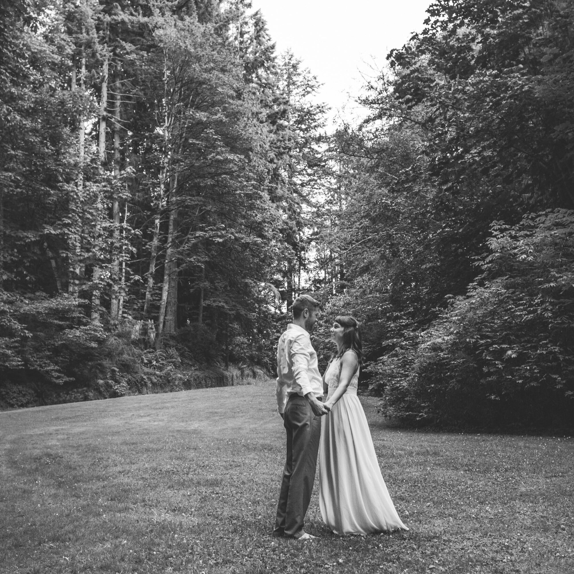 meadow-travel-elopement-couple-holding-hands-black-and-white.jpg